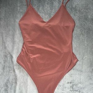 Brown bodysuit size extra small V-neck never worn